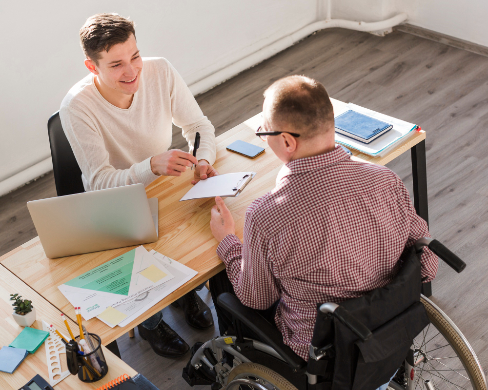 disabled person filling papers